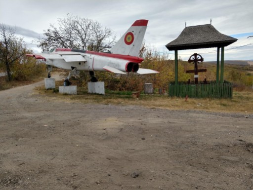 In the "What the Heck" category, we cound not understand why this Soviet jet fighter would be mounted next to a crusifix about 30 kilometers from the nearest village.